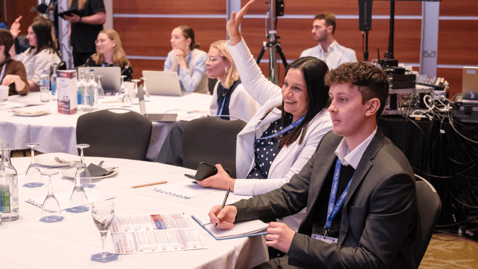 Audience raising their hands